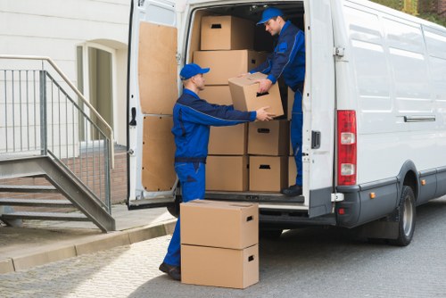 Moving team handling furniture with care during unloading