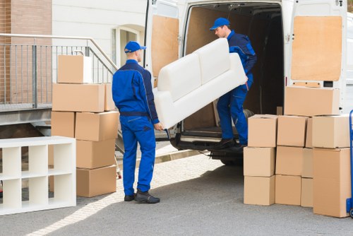 Professional removal van loading furniture in Islington
