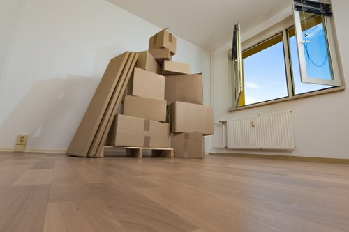 Professional movers navigating a narrow Islington road