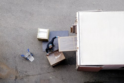 Professional movers handling furniture carefully in an Islington property