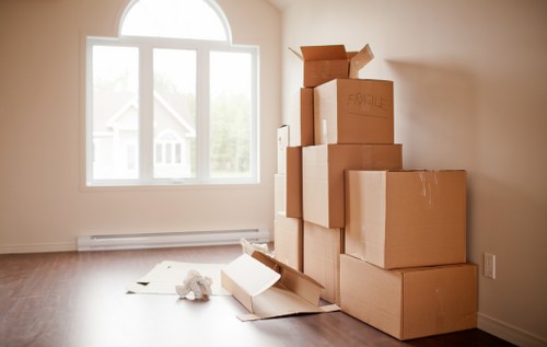 Professional man and van loading household items in Islington