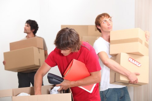 Professionals packing office IT equipment for relocation in Islington