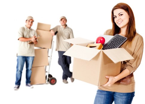 Office movers unloading furniture at a new workplace in Islington
