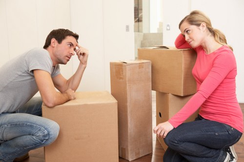 Manager reviewing a removals complaint with service records